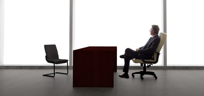Businessman with Empty Chair