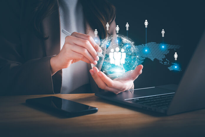 Businesswoman Using Computer With Global Structure Customer Netw
